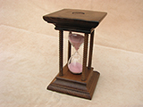 20th Century Oak framed sand timer with turned pillars